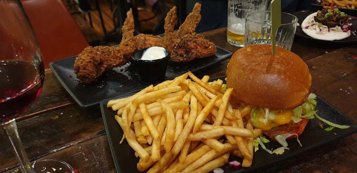 Burger with chips and chicken wings